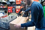 Colleagues working on delivery and packaging in warehouse