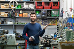 Fencing prop maker posing with fencing sword