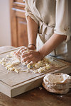 Woman preparing dough for gnocchi