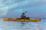 Man kayaking near glacier, Narsaq, Vestgronland, Greenland