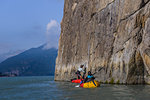 Friends packrafting, Howe Sound bay, Squamish, Canada