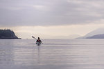 Woman kayaking in lake, Johnstone Strait, Telegraph Cove, Canada