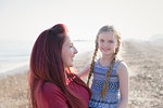 Portrait mother and daughter on sunny beach