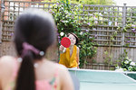 Mother and daughter playing table tennis