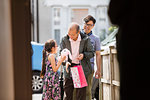 Grandfather giving granddaughter stuffed animal