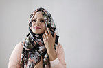 Portrait confident woman wearing floral hijab