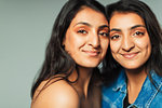 Portrait smiling, confident teenage twin sisters