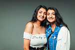Portrait smiling, confident twin teenage sisters