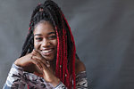 Portrait smiling, confident young woman with red braids