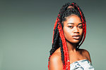 Portrait confident, cool young woman with red braids