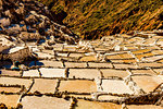 Salt terraces in the Sacred Valley where people are still mining and sifting the terraced pools as the Incas did 1000 years ago, Peru, South America