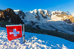 Swiss flag with Palu and Vedret Pers Glacier, Diavolezza Refuge, Bernina Pass, Engadine, Graubunden, Switzerland, Europe