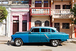 Old blue American car parked in front of old buildings, Cienfuegos, UNESCO World Heritage Site, Cuba, West Indies, Caribbean, Central America