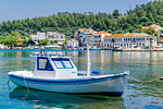 Moored small white boat with Greek flags, Limenas Town, Thassos island, Greek Islands, Greece, Europe