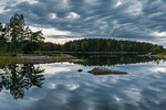 Overcast sky reflecting on to river in Ostergotland, Sweden