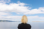 Woman by sea in Cromarty, Scotland