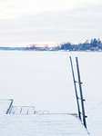 Ladder against deck in snow in Sigtuna, Sweden