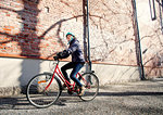 Mid adult woman riding a bicycle in Lahti, Finland