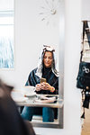 Hairdressing client with foil in hair in Sweden