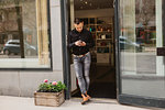 Hairdresser at door of salon in Sweden