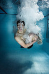 Swimmer jumping into pool