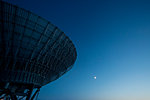 Satellite dish against blue sky
