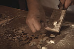 Cook making gnocchi in kitchen