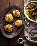 Plate of baked mushrooms and salad