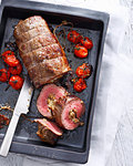 Tray of braciole with tomatoes