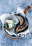 Bowl of smoked fish with salad