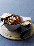 Bowl of caponata with flatbread