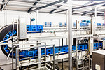 Empty crates on bottling plant conveyor belt