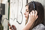 Girl listening to music on smartphone