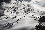 View of snow and clouds in valley, Bavarian Alps, Oberstdorf, Bavaria, Germany