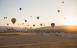 Hot air balloons above field landscape, Cappadocia, Anatolia,Turkey
