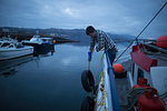 Fisherman preparing trawler, Isle of Skye, Scotland