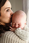 Mother soothing crying baby boy