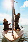 Mature couple on sailing boat, smiling