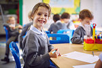 Portrait of girl at desk in elementary school