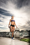 Runner stretching on dirt path