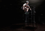 Young man leaping in gym