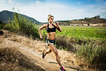 Female runner in rural landscape