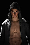 Body builder with hoodie exposing abdomen muscle