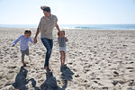 Mother holding hands with son and daughter, Newport Beach, California, USA