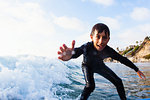 Young boy surfing, Encinitas, California, USA