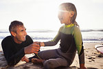 Father and daughter holding hands on beach, Encinitas, California, USA