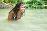 Teenage girl having fun in the river