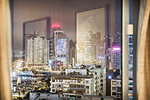 City and reflections viewed through window, Hong Kong, China