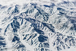 Aerial view of snow covered mountains, Western China, East Asia