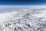 Aerial view of snow covered mountain range, Western China, East Asia